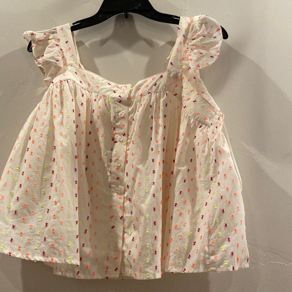Francesca’s babydoll tank with flutter sleeves. So fun and cool for the summer!